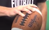 how to hold a football